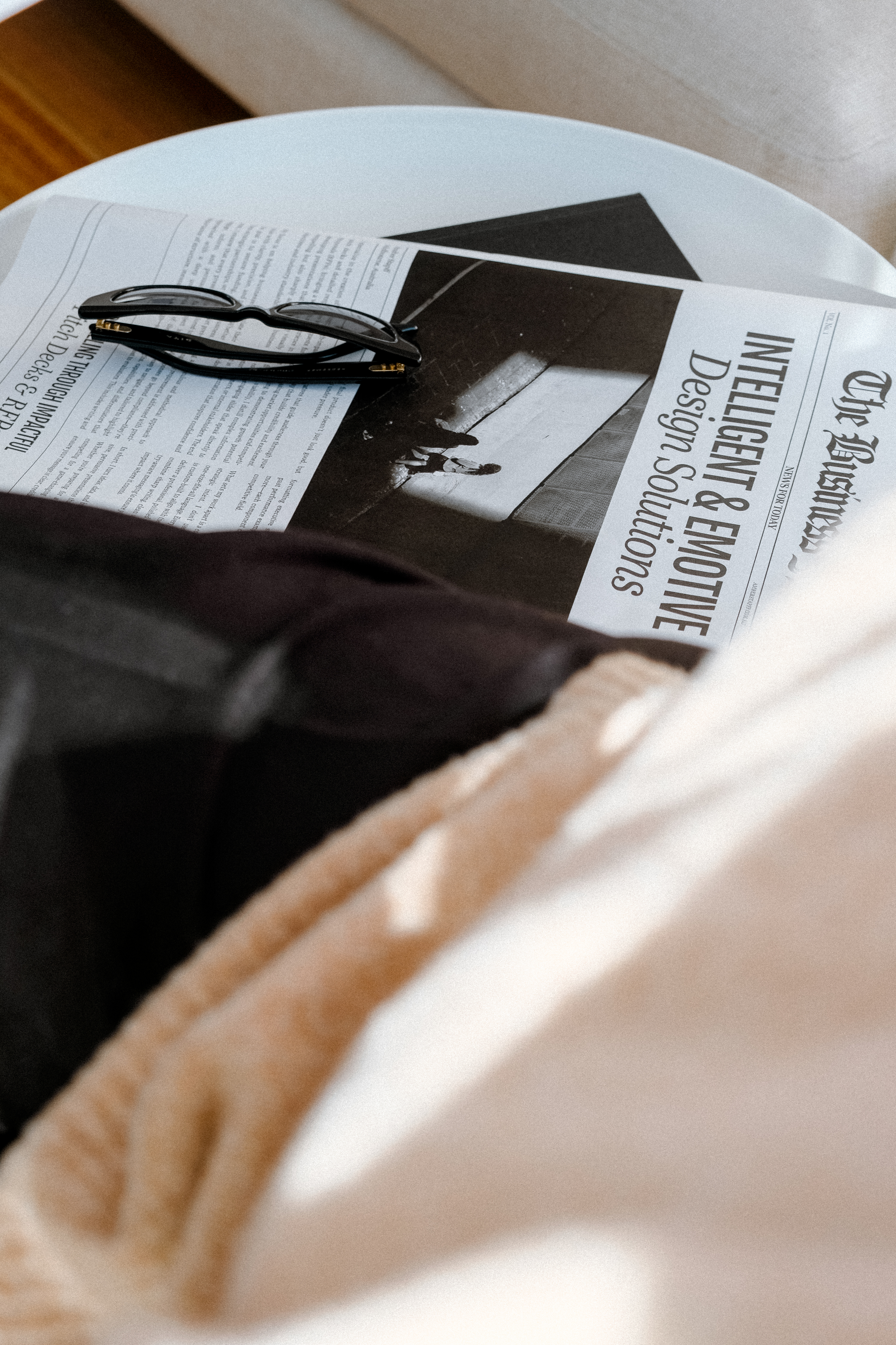 Portrait of a woman with brown hair on a flat gray background.